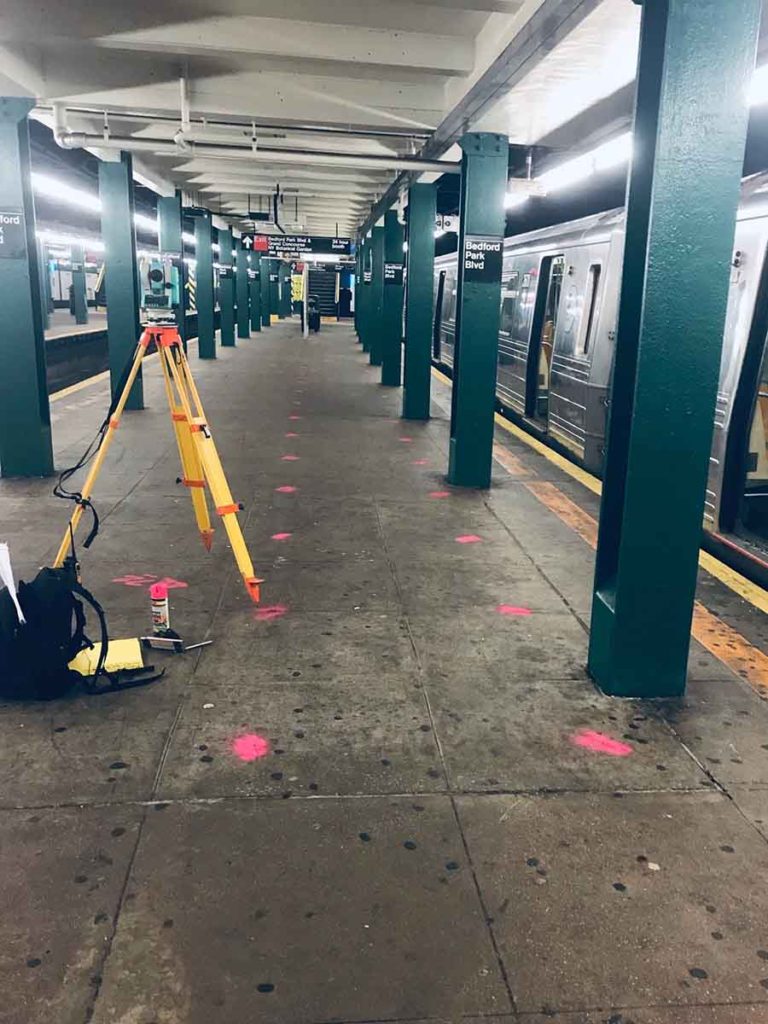 Surveying subway platform in NYC